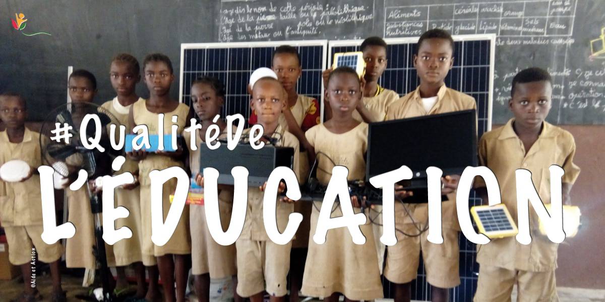 children in west africa receive computer equipment as part of the ALFA school electrification project