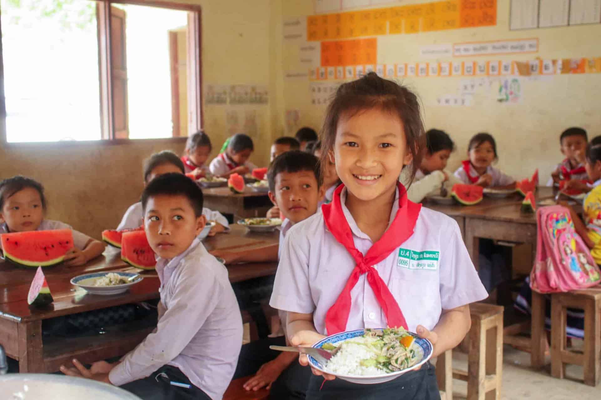 school nutrition: girl in a rural school with her lunch